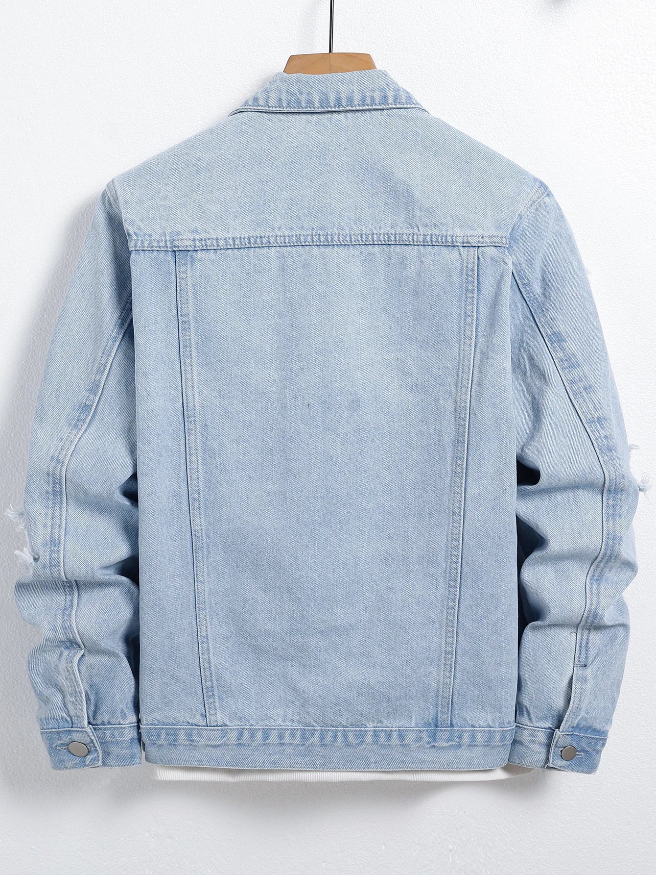 Men's light blue ripped denim jacket. Stylish and trendy. Street casual.