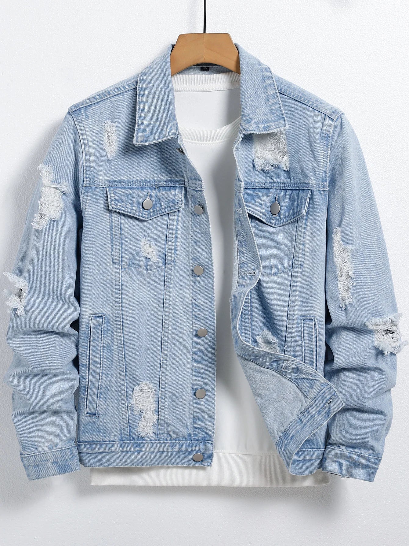 Men's light blue ripped denim jacket. Stylish and trendy. Street casual.