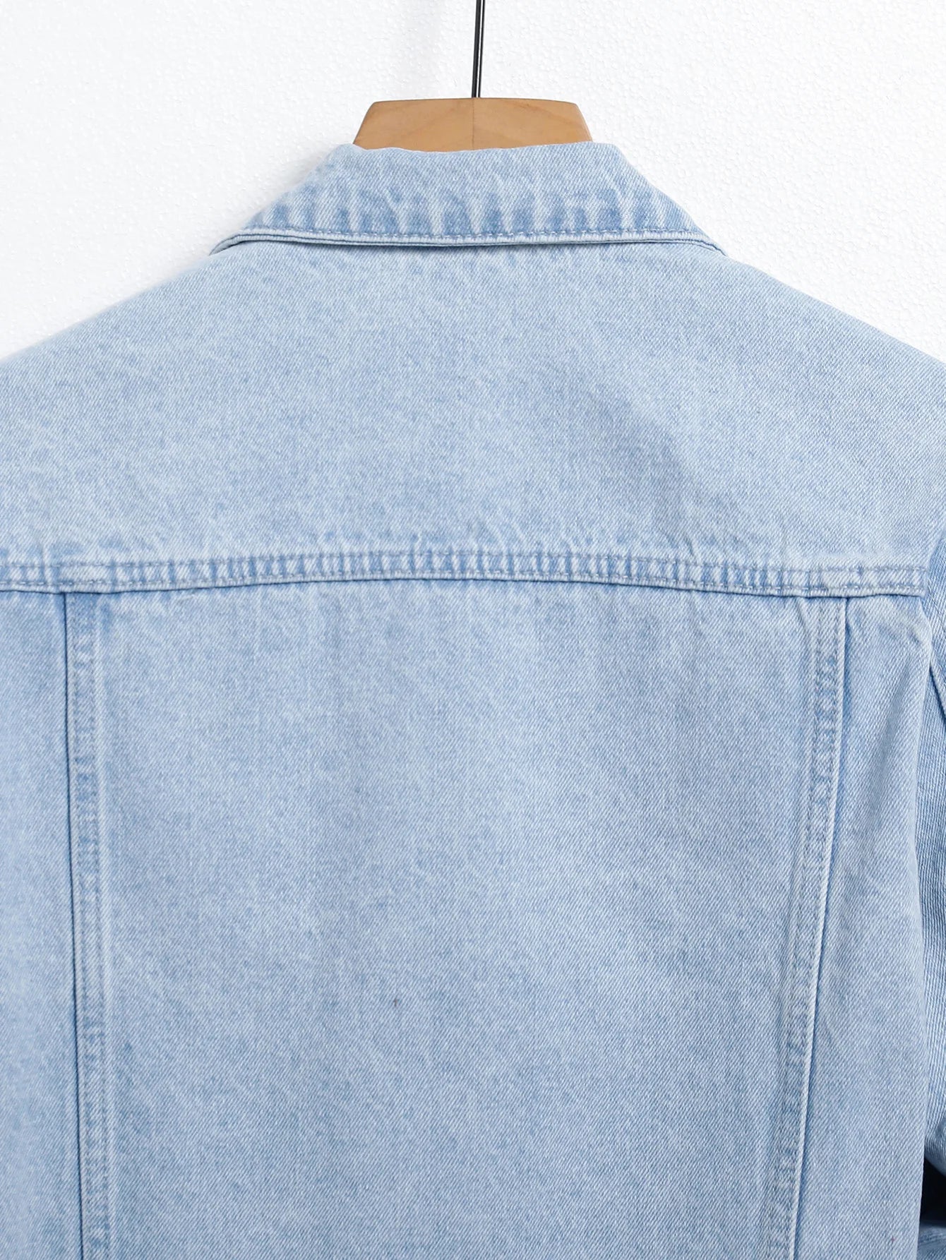 Men's light blue ripped denim jacket. Stylish and trendy. Street casual.